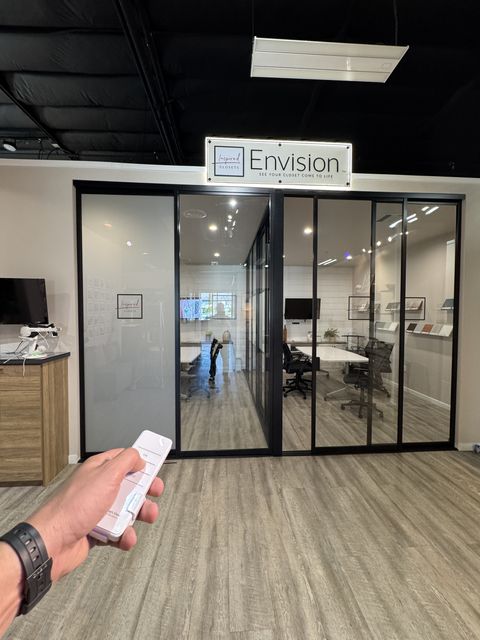 Smart Glass Closets Woodland Hills showroom featuring a fully transparent smart glass closet display