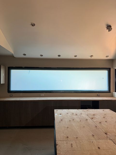 Switchable smart film on an oversized window in clear-mode showing full daylight transmission across the architectural surface