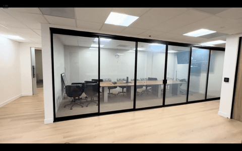 Switchable Smart View privacy film installed on a glass-walled boardroom in Beverly Hills, mid-transition