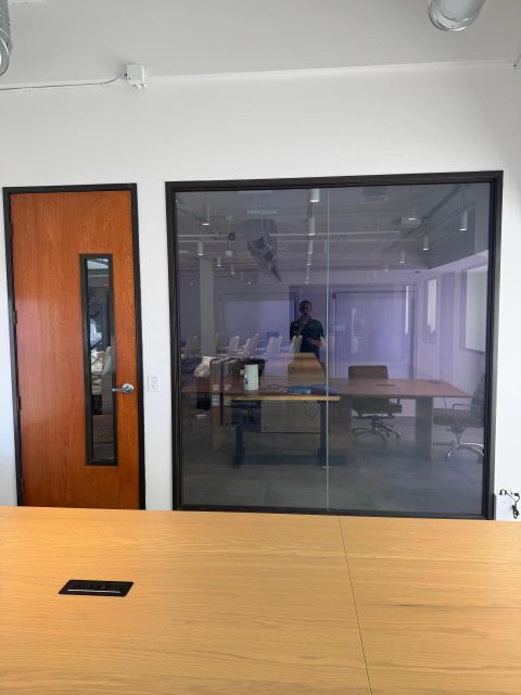 Switchable smart glass conference room wall in frosted mode at office in Beverly Hills CA