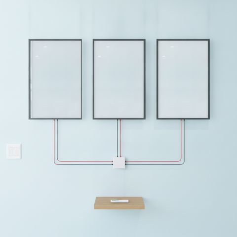 Illustration of a complete smart glass system: three frosted switchable panels on a wall, each with two thin leads running to one compact transformer, plus a wall switch and a wireless remote