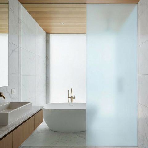 The same shower-enclosure glass switched to frosted opaque privacy