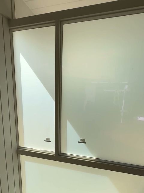 Palm Springs master bedroom window wall with smart film switched to frosted privacy white