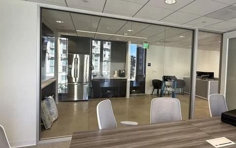 Smart glass conference room in Beverly Hills office with switchable privacy glass walls