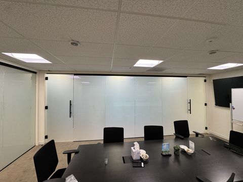 Thousand Oaks office conference room with the smart film glass wall and doors frosted to a solid privacy white