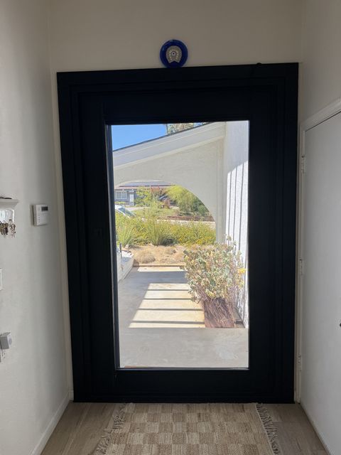 Wider view of the Topanga entry, door glass clear to the courtyard