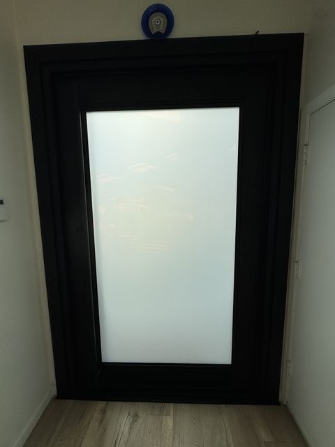 Topanga front door with smart film frosted to an even milky white