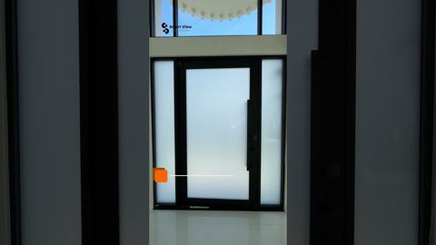 Entry door and sidelights fitted with switchable privacy glass, shown frosted