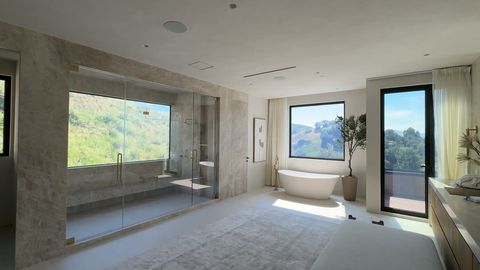 Hidden Hills luxury master bathroom with hillside views and switchable privacy glass