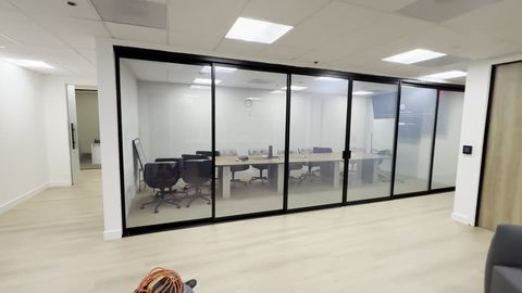 Thousand Oaks conference room six-panel sliding glass wall switching to frosted privacy