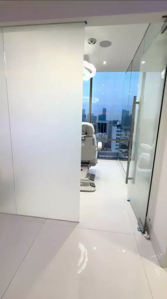 Smart glass door in Beverly Hills surgery clinic with frosted privacy mode