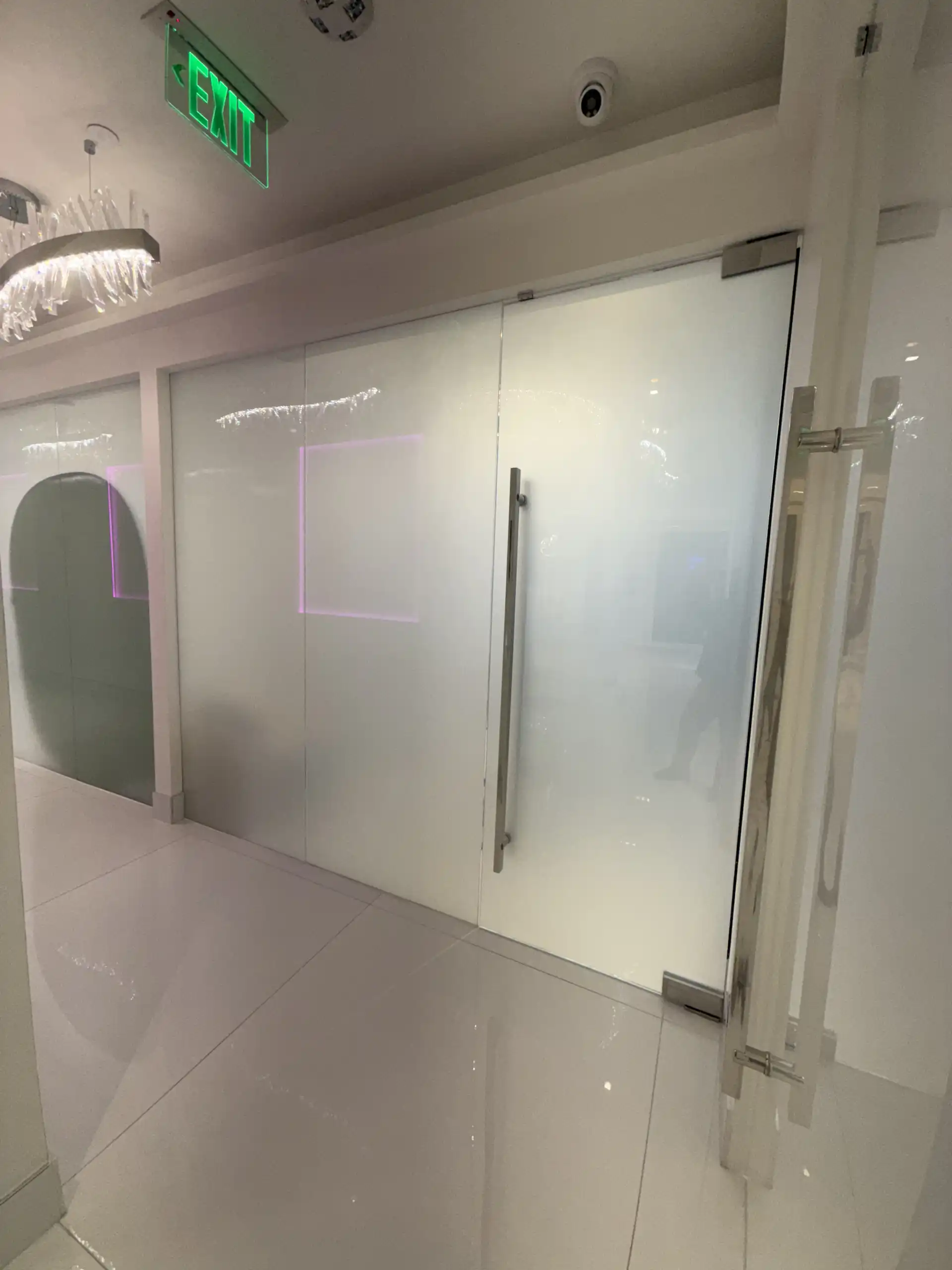 Smart glass sliding door in frosted mode at surgery clinic in Beverly Hills CA