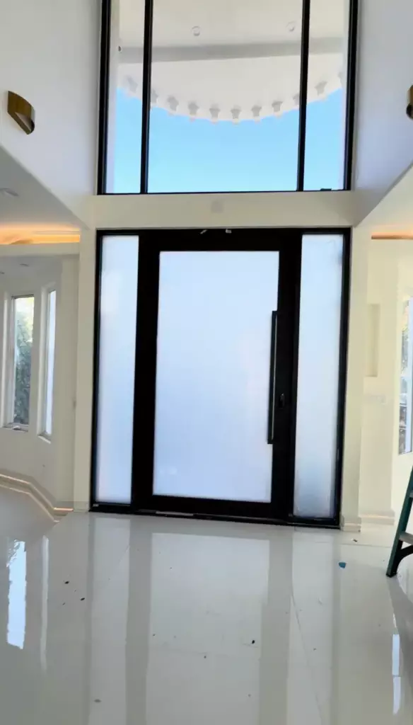 Smart glass front door in Beverly Hills home with frosted privacy mode
