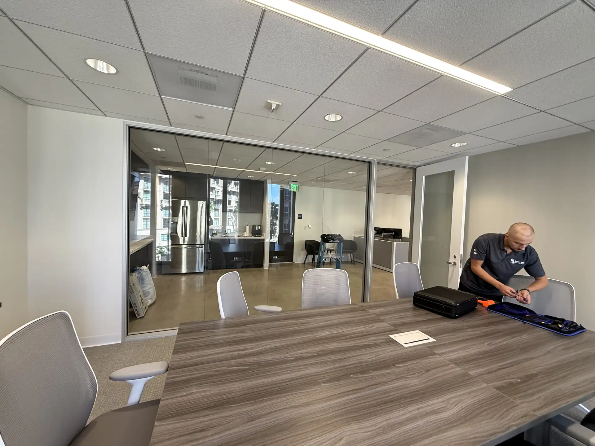 Smart glass conference room in Beverly Hills office with switchable privacy glass walls