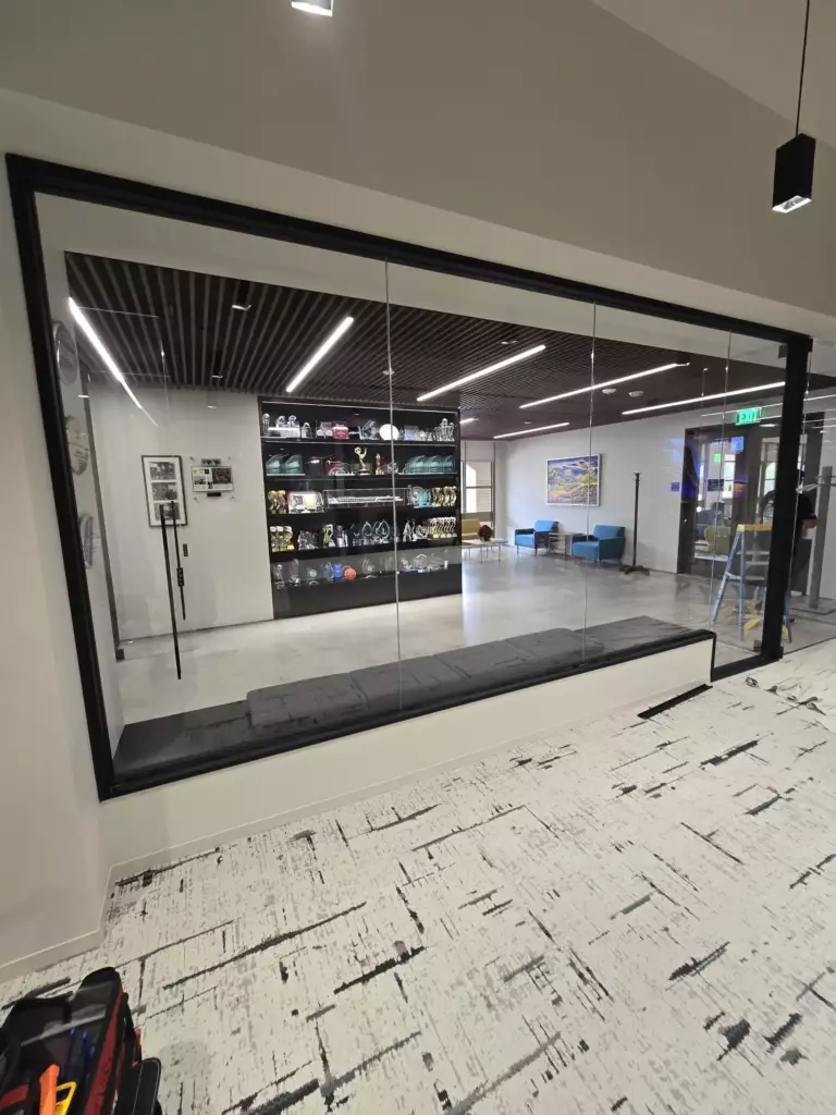 Smart glass conference room in Calabasas CA with black frame glass wall system