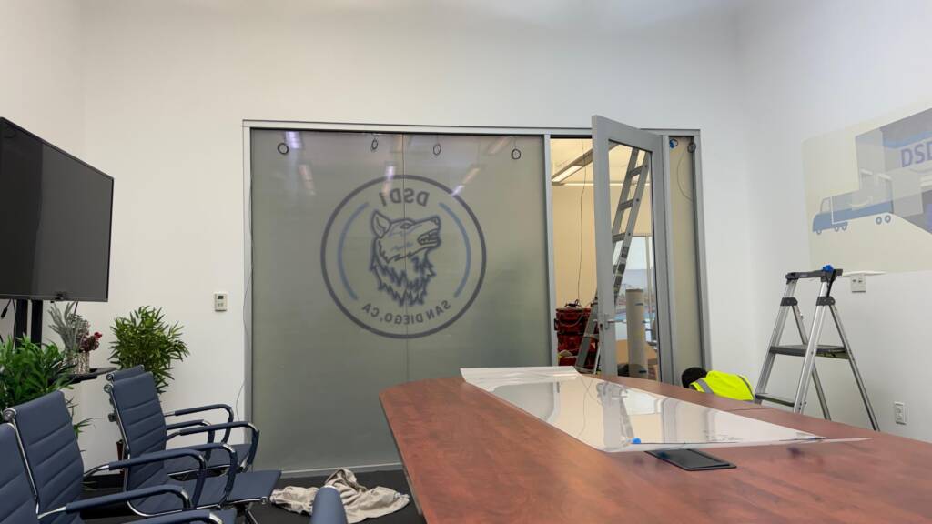 Smart film installation in progress on office conference room glass in San Diego CA