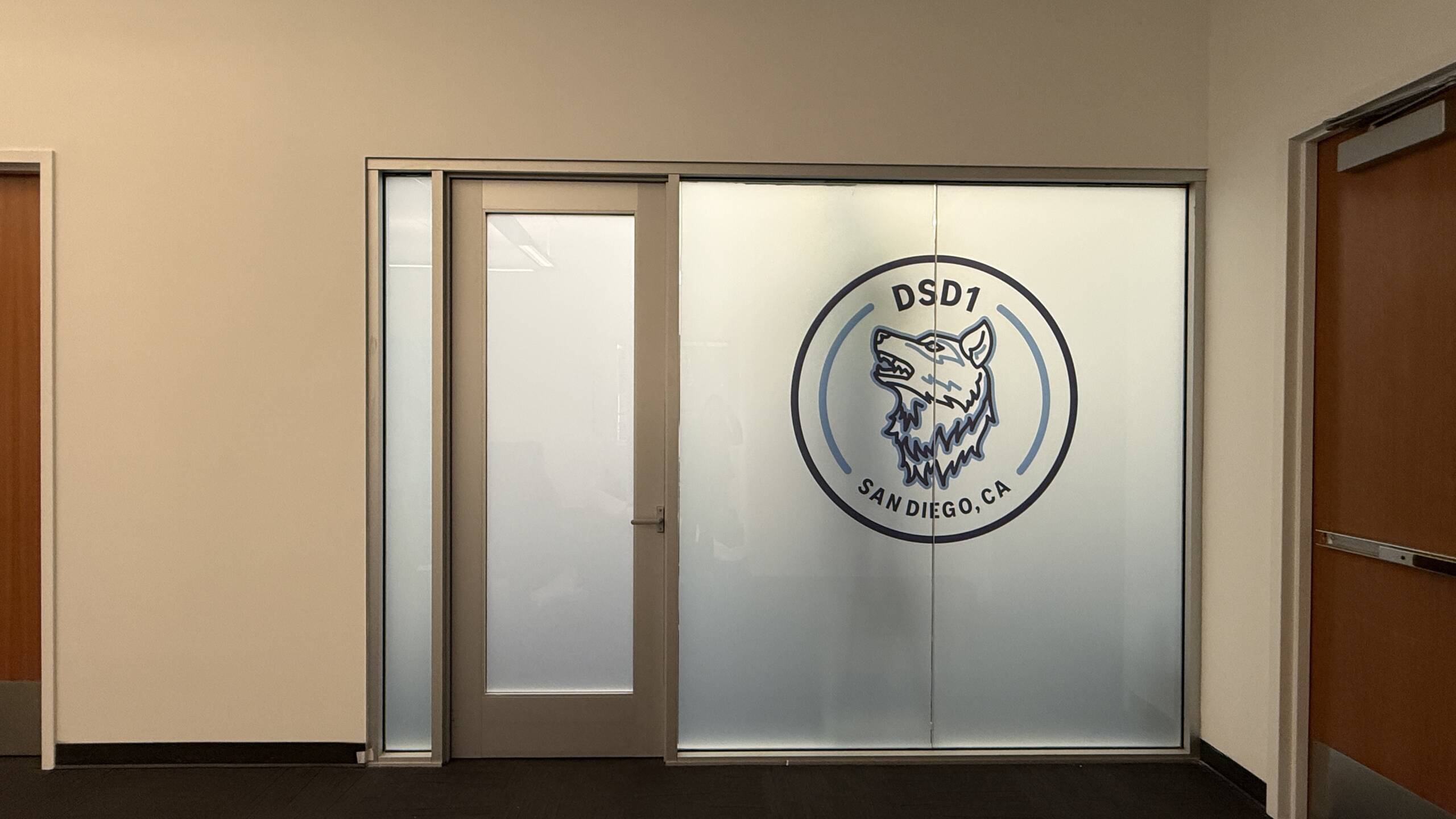 Custom logo privacy film installed on office glass in San Diego CA