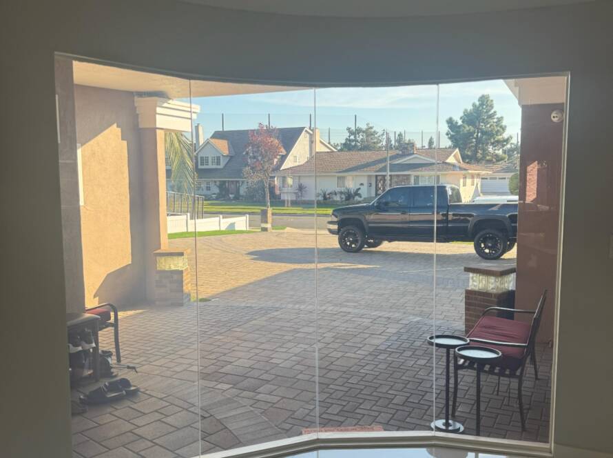 Curved living room window with smart film in Lakewood CA in clear mode