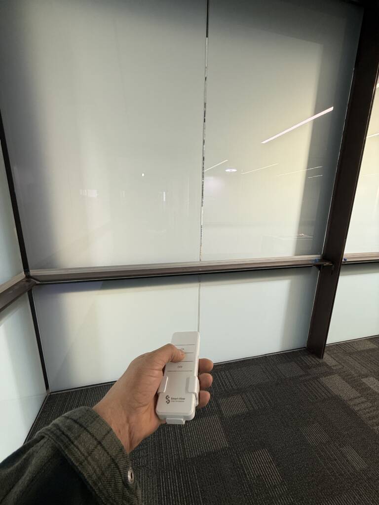 PDLC smart glass wall in Carlsbad CA conference room in frosted privacy mode