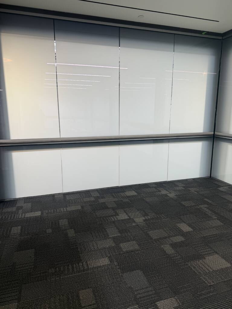 Conference room smart glass wall in Carlsbad CA switched to opaque mode