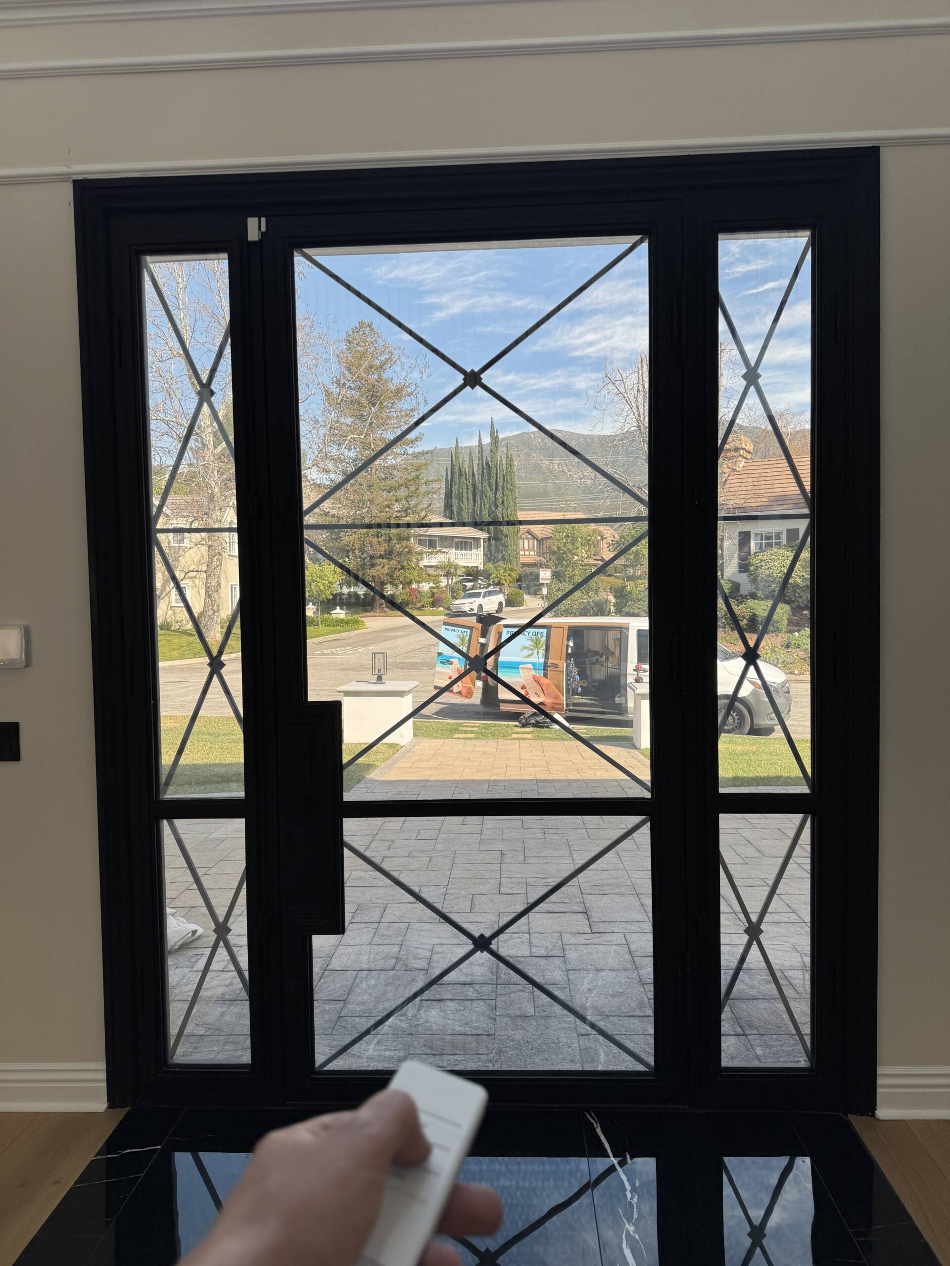 Smart film front door in La Cañada CA showing clear transparent mode