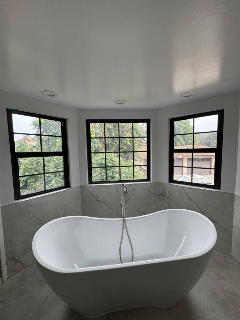 Electric switchable privacy glass windows tinted opaque in a West Covina bathroom
