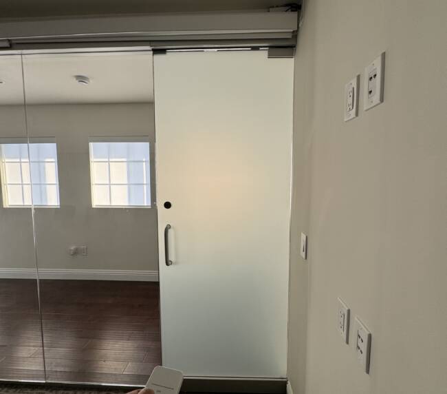 Frosted privacy mode on a meeting room wall in a Hermosa Beach office