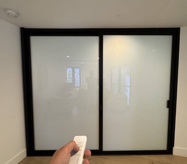 Smart glass home office walls in frosted privacy mode in Huntington Beach