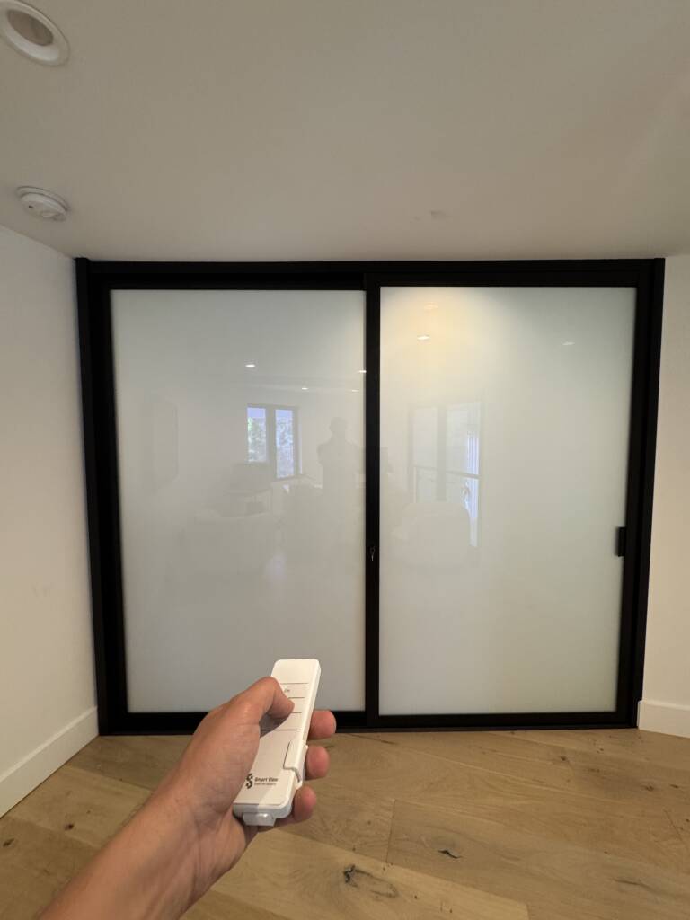Smart glass home office walls in frosted privacy mode in Huntington Beach