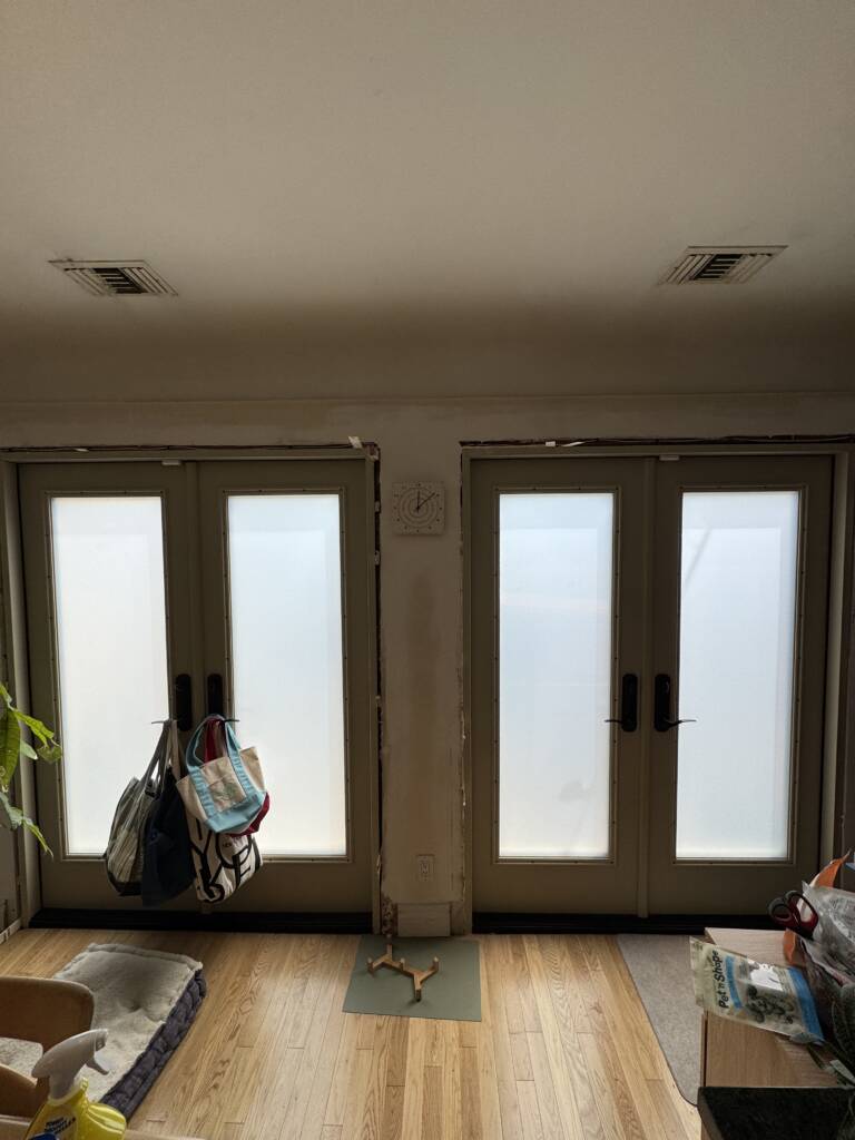 Switchable french doors in frosted privacy mode in a Los Angeles residence