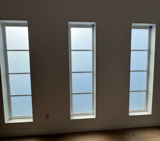 Smart glass windows Manhattan Beach &mdash; front door sidelight in clear state showing daylight view to street