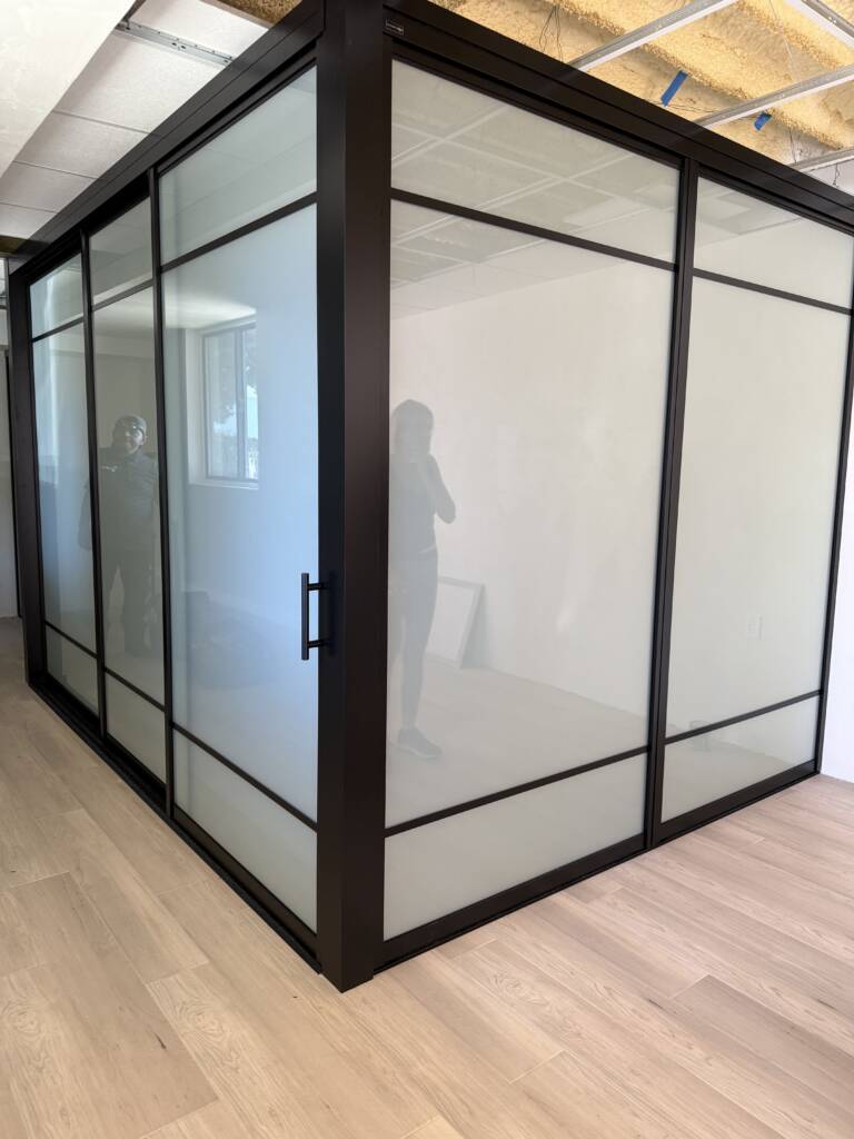 Premium smart glass doors and windows in Malibu featuring instant privacy control and unobstructed coastal views.
