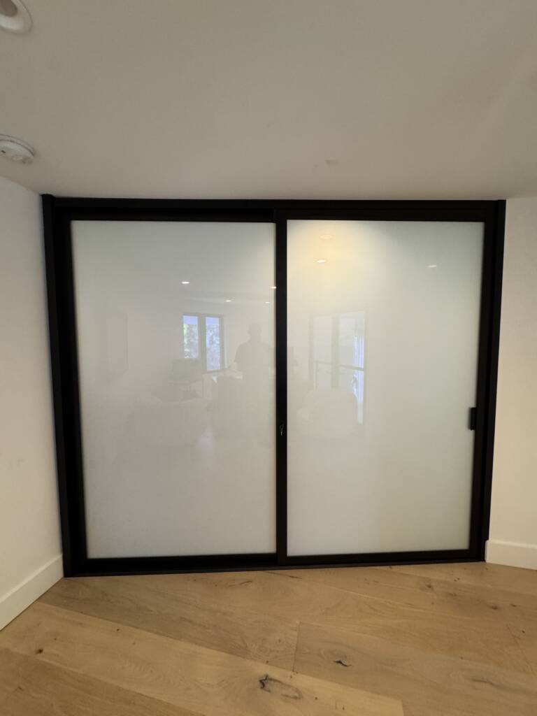 Switchable privacy glass in a Santa Barbara property offering instant frosted glass for enhanced comfort and privacy.